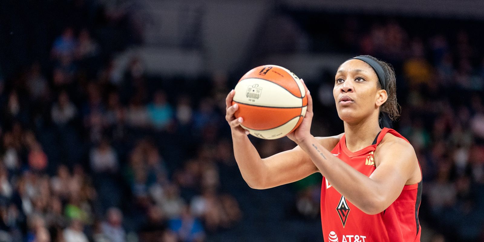 A'ja Wilson in a red Las Vegas Aces jersey shooting a free throw