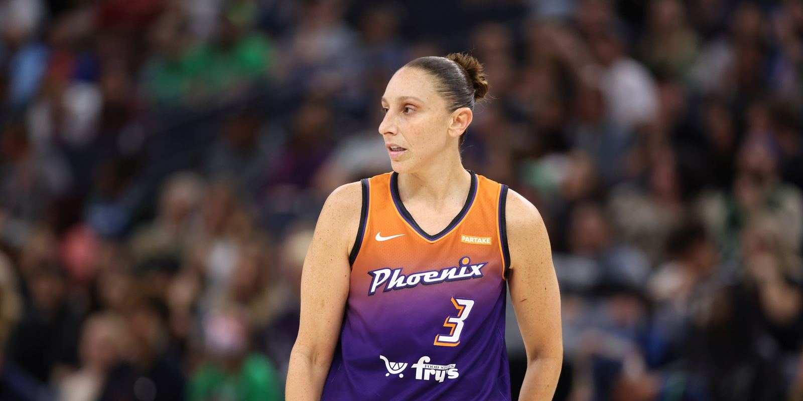 Diana Taurasi in a purple Phoenix Mercury number 3 jersey on court