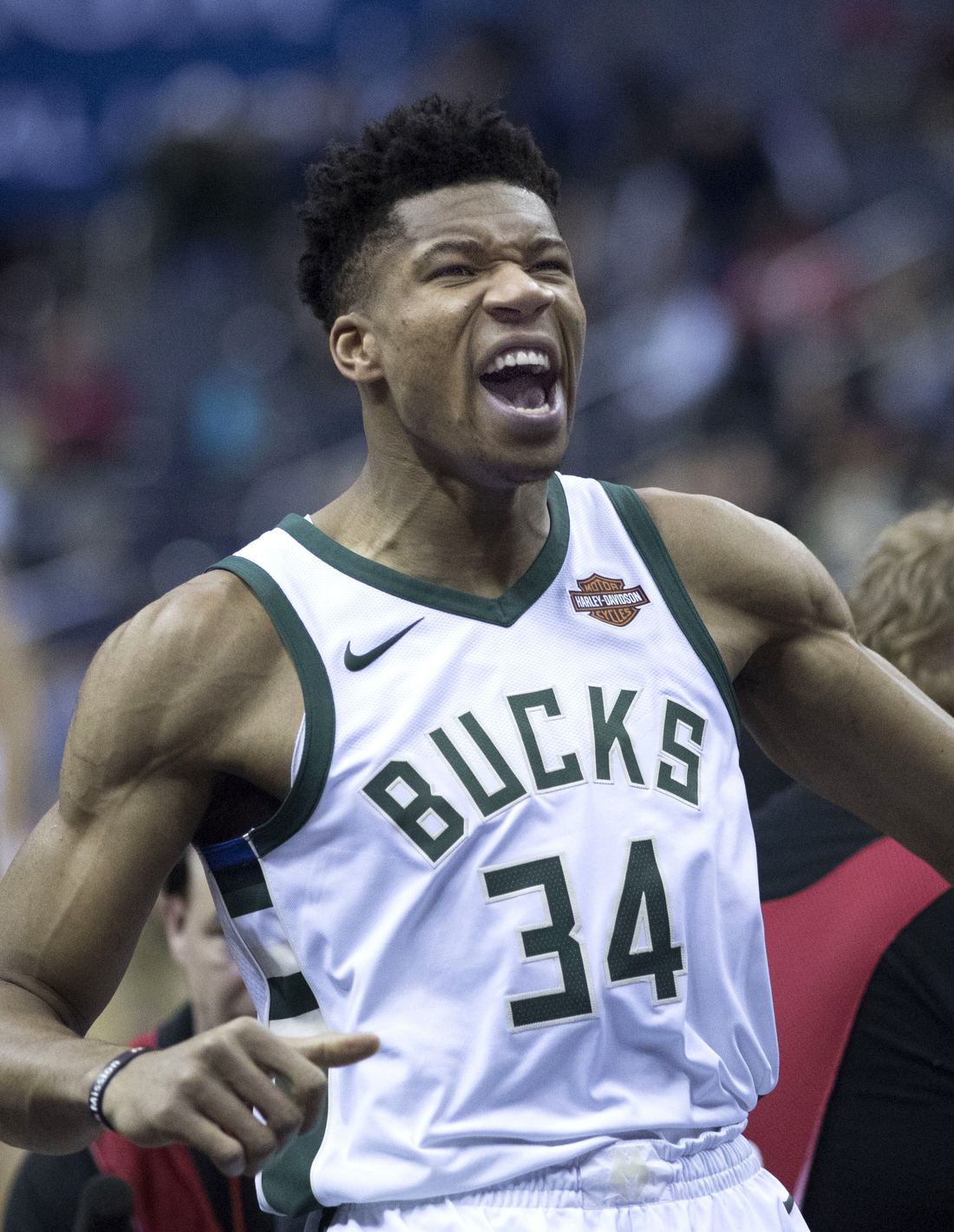 Giannis Antetokounmpo celebrating in a Milwaukee Bucks jersey