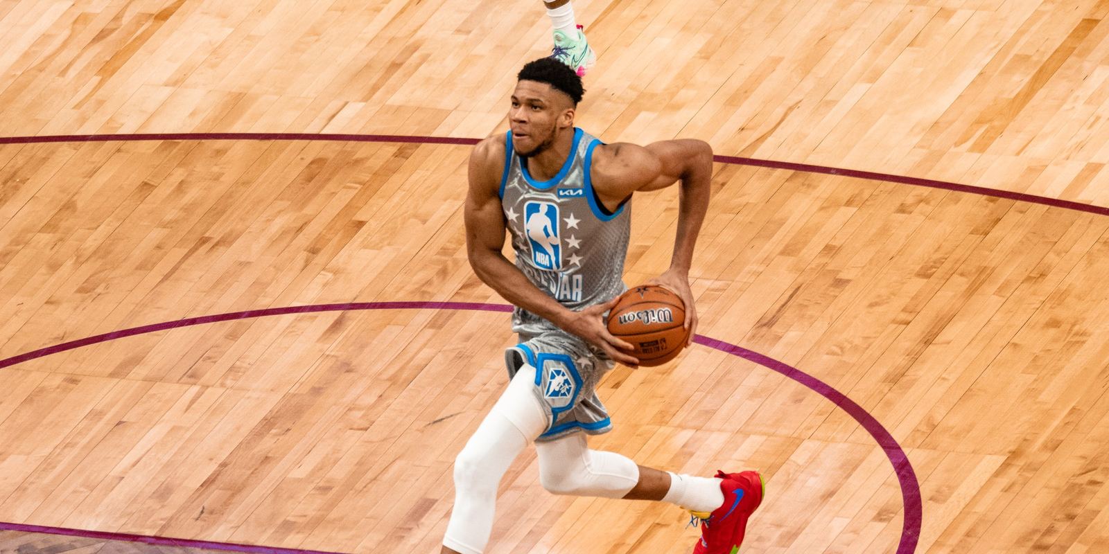 Giannis Antetokounmpo driving to the basket in an All-Star game