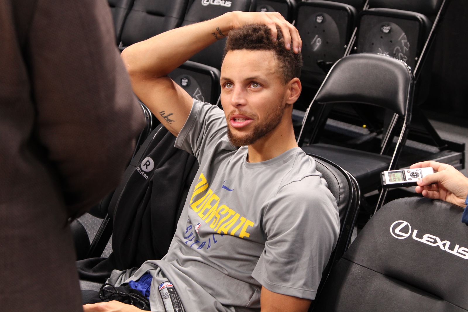 Stephen Curry speaking to reporters